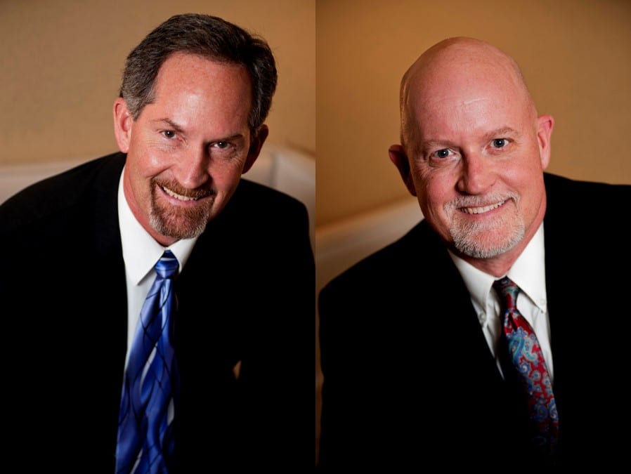 Two head-and-shoulders portraits side by side of men in dark suits and ties