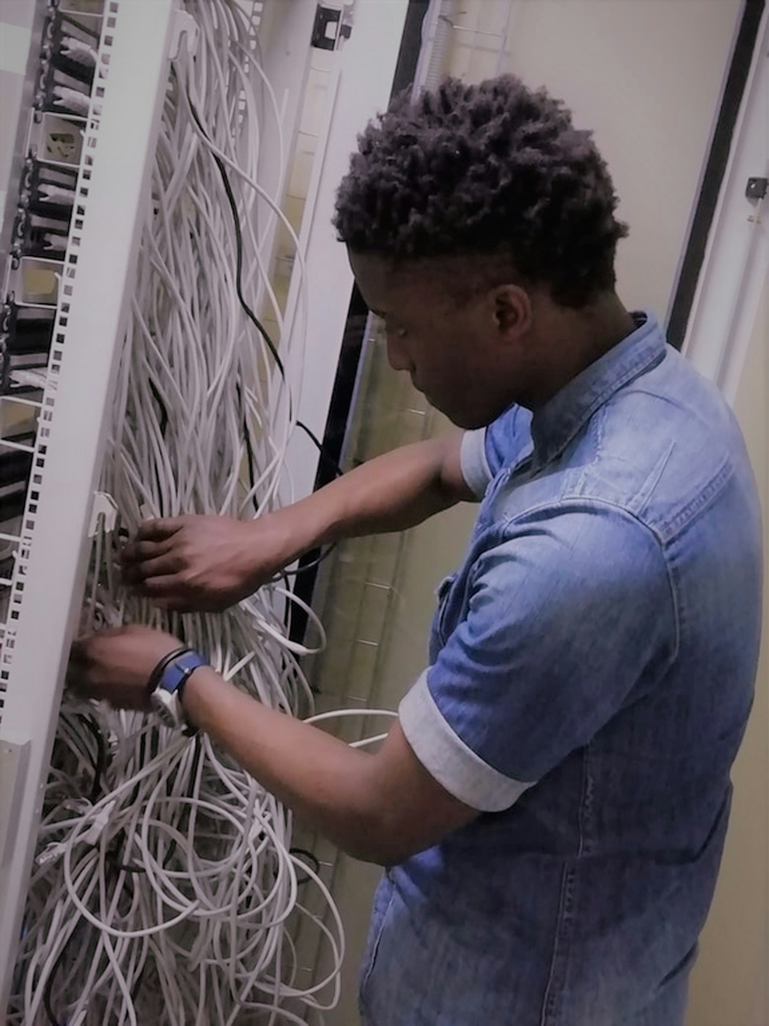 Access field technician servicing critical equipment