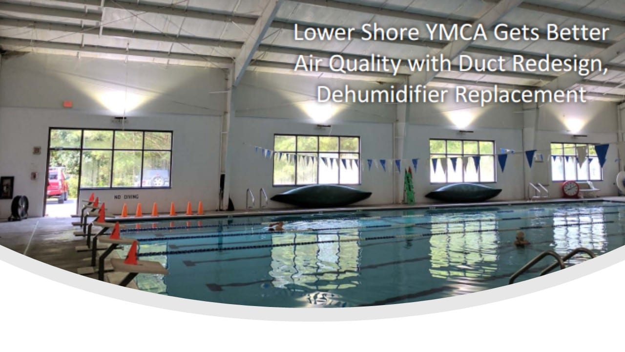 An indoor swimming pool with lane ropes and starting blocks, captioned "Lower Shore YMCA Gets Better Air Quality with Duct Redesign, Dehumidifier Replacement"